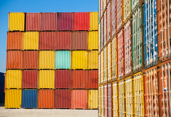 Fototapeta premium Stacked shipping containers in a warehouse yard