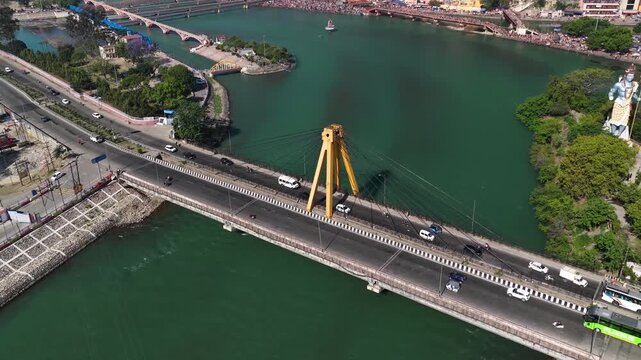 Drone reveling shot showing traffic on haridwar highway bridge, 4k footage 