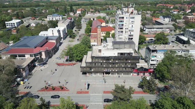 Aerial drone lateral panning shot of Vrbas city center, Serbia, sunny day.