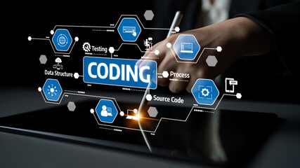 Fototapeta premium A hand holds a stylus above a tablet displaying various coding icons and symbols. This image illustrates the concepts of programming, testing, and software development. Tessel