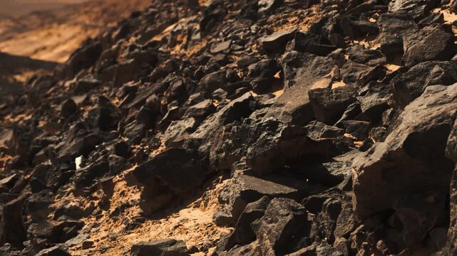 Close-up of basalt rocks in Egypt&rsquo;s Black Desert. Detailed close-up of dark basalt rocks in Egypt&rsquo;s Black Desert. Highlights the texture, rugged surfaces, and natural patterns of the volcanic terrain 
