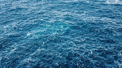 Obraz premium Blue ocean water with small waves, Concept of nature and sea, Represents travel and landscape, Perfect for background and marine content made by AI generative