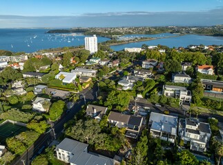 Obraz premium Aerial view of Parnell, Auckland, New Zealand, showcasing the cityscape, harbor with sailboats, and residential areas with lush greenery. Captures the beauty of the coastal city.