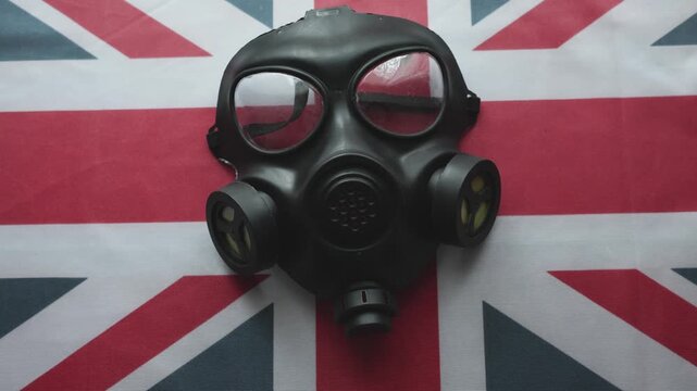 Gas Mask on United Kingdom Union Jack Flag - Nuclear Disaster and War Concept