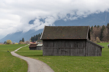 Fototapeta premium Rustic Barn Beside Alpine Path in Bavaria