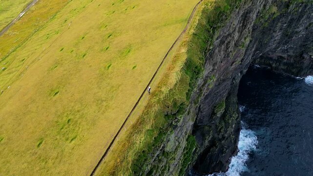 Cinematic 4K aerial drone shot soaring over the rugged cliffs at Gjogv, Faroe islands, Denmark