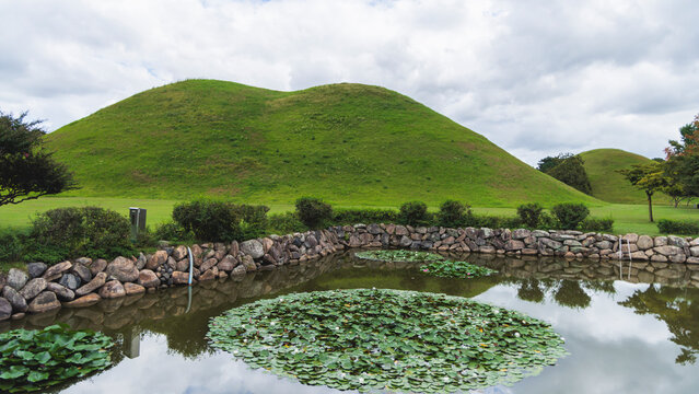 Daereungwon Tomb Complex in a sunny day, Gyeongju, South Korea, tumulus royal imperial Silla dynasty tombs, mound green grassy hill, North Gyeongsang Province, Gyeongju city view, Yeongnam region