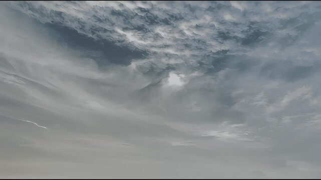 Dramatic cloudy sky with dynamic cloud formations and sunlight