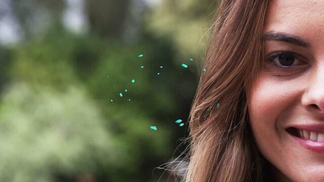 Right closeup woman shifting neutral to laughing after teal bits showing then drifting, reacting