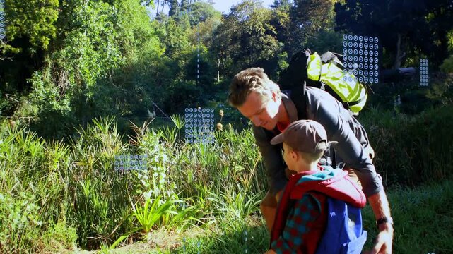 Dad walking kid along pond trail, kid pointing causing reed popup for view, dad lifting, walking