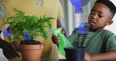 Spraying boy in green shirt holding green spray bottle watering pot at home table, blue overlay © vectorfusionart