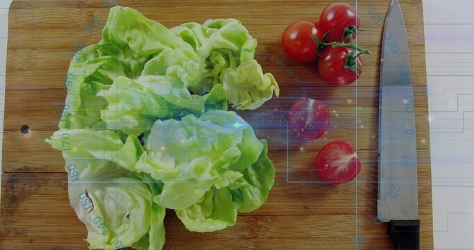 Sitting butterhead lettuce on board with hole, showing knife, tomatoes, lined paper, blue overlay