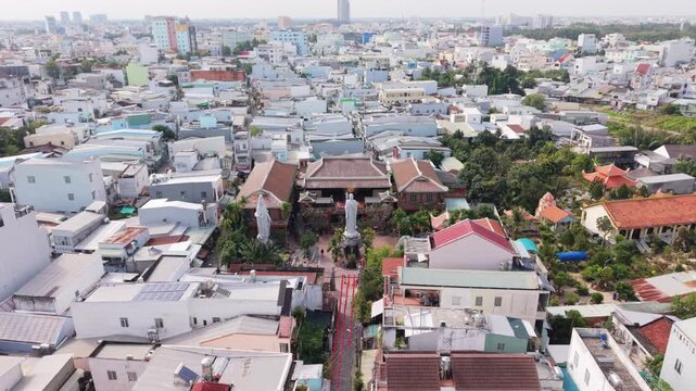 Compact Temple With Surrounding Homes. Elevated View Of Religious Center Amidst Neighborhood. Aerial Perspective Highlighting Temple Enclave Among Densely Packed Residences
