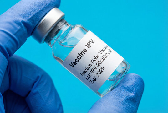 Doctor or nurse holding a vial of the inactivated polio vaccine IPV