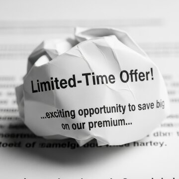 Limited Time Offer Crumpled Paper on Printed Background.