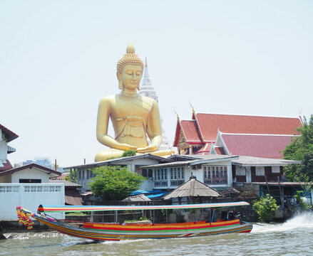 The large Buddha statue is located at Wat Pak Nam, Phasi Charoen District, Bangkok, Thailand.
