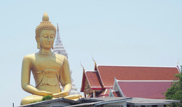 The large Buddha statue is located at Wat Pak Nam, Phasi Charoen District, Bangkok, Thailand.