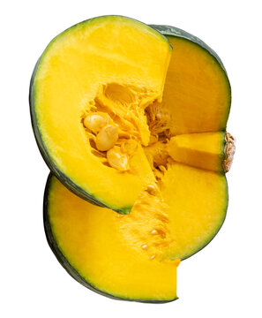 Green Japanese pumpkin fruit in half and two quarters or slices in stack isolated on white background with clipping path