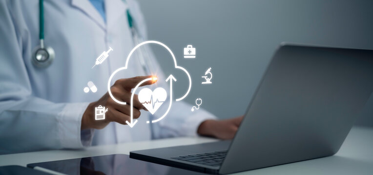 Doctor using laptop with cloud healthcare interface digital medical data telemedicine system heart monitoring technology online service modern hospital innovation concept