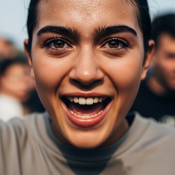 A happy, sweaty woman smiles broadly directly at the camera. concept of soccer fan rooting in the 2026 soccer world championship Tournament.