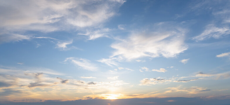 Beautiful morning or evening blue and orange sky with cloudy while sunsets or sunrises taken at the sea used as natural background texture