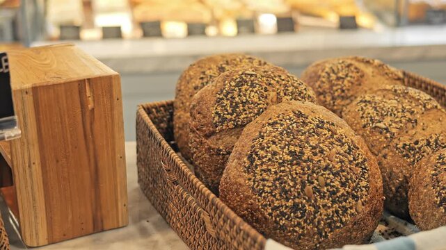 Artisan bakery display with fresh loaf selection rustic loaf texture and golden crust Sourdough loaf on shelf handmade bread showcase organic bakery concept healthy food market and warm aroma