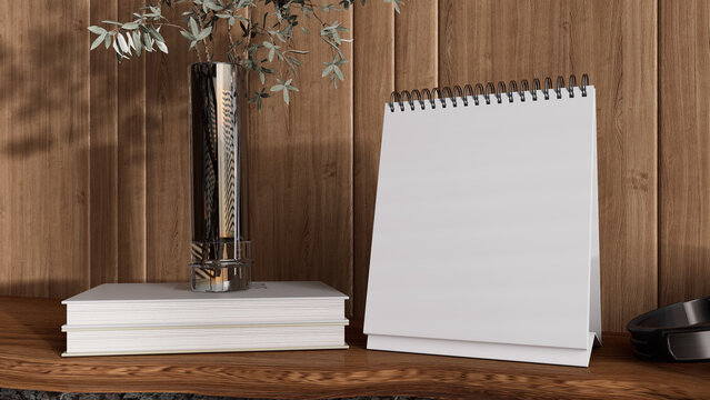 Blank desk calendar mockup with spiral binding on modern table, styled with books and dried flowers in glass vase, elegant interior scene for branding, office stationery design, ads and product