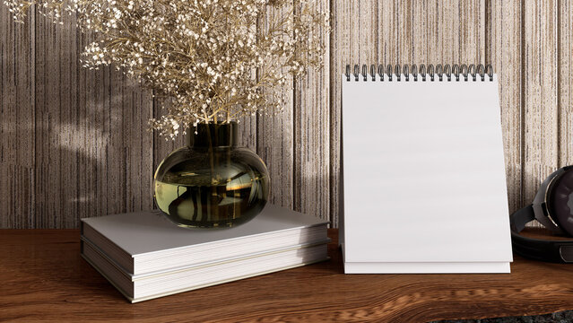 Blank desk calendar mockup with spiral binding on modern table, styled with books and dried flowers in glass vase, elegant interior scene for branding, office stationery design, ads and product