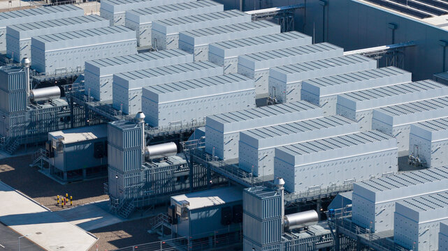 Aerial view of Datacenter Westpoort with rows of cooling units and industrial infrastructure in Groningen, Groningen, Netherlands.