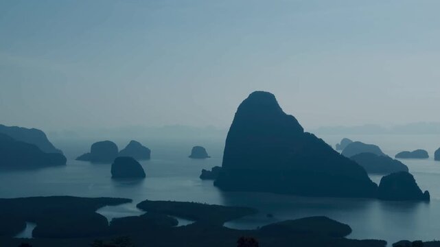 Horizontal video of iconic James Bond island karst rocks in Phang Nga Bay, Thailand. Beautiful tropical sea water and famous limestone mountain cliffs under soft sky, bestselling travel site clip.