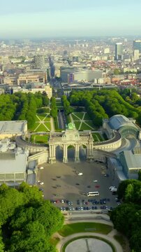 Vertical video. Brussels, Belgium. Park of the Fiftieth Anniversary. Park Senkantoner. The Arc de Triomphe of Brussels (Brussels Gate). Drone footage. Rich colors
