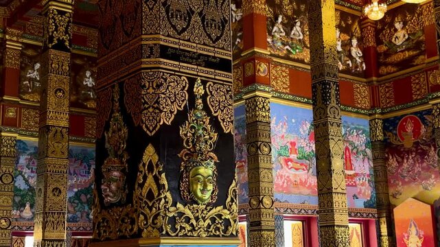Sacred golden interior of Wat Bang Thong temple in Krabi, Thailand. Spiritual Buddhist shrine with traditional religious art, sacred symbols and divine meditation atmosphere.