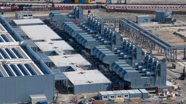 Aerial view of Datacenter Westpoort showing rows of cooling units and industrial piping at the modern facility in Groningen, Groningen, Netherlands.