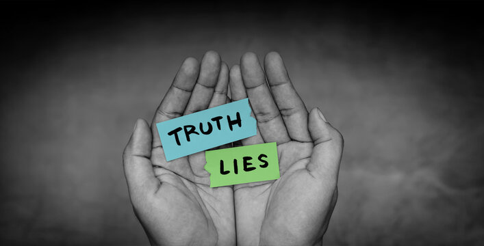 Hands holding truth and lies message, honesty versus deception, moral dilemma, trust and integrity