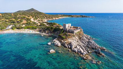 Fototapeta premium Aerial view of the Fortezza Vecchia, a medieval coastal fortress on a rocky promontory in Villasimius, Sardinia, Italy
