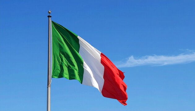 Italian national flag flying on flagpole against clear blue sky, vertical stripes of green, white, and red symbolizing unity, heritage, and pride.
