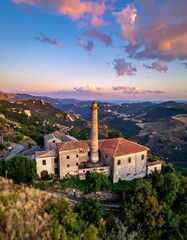Fototapeta premium A serene landscape of an old building complex on a hilltop