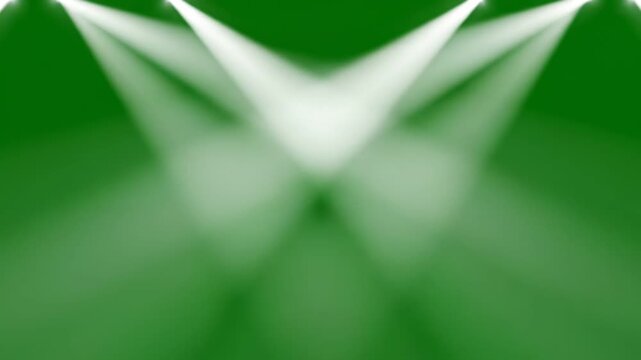 Energetic stage spotlights beam down onto a dark green background creating dramatic lighting effects and a sense of anticipation for a performance concert or event with bright white light 4k ai video