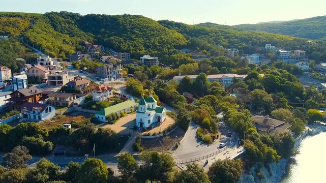 Abrau-Diurso, Krasnodar Krai, Russia. Lake Abrau. Embankment and village. Summer. Church of Xenia of Petersburg. Drone footage, Point of interest