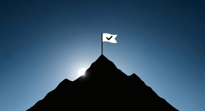 Silhouette of a mountain peak against a clear blue sky with the sun partially visible behind the summit topped with a white flag bearing a black checkmark symbolizing achievement