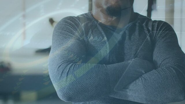 Man folding arms in tech studio, camera revealing face, overlay swirling introducing speaker