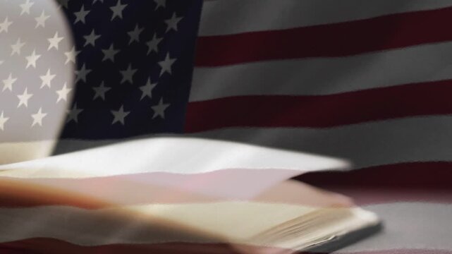 Pages starting lifting, book pages fanning and sweeping across flag, revealing layers and settling
