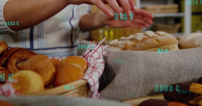 Arranging woman hands placing loaf on bakery counter wearing striped apron with basket, teal tags