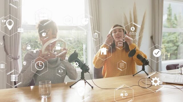 Left host reaching for headphones, hexagon overlays appearing, hosts placing them preparing podcast