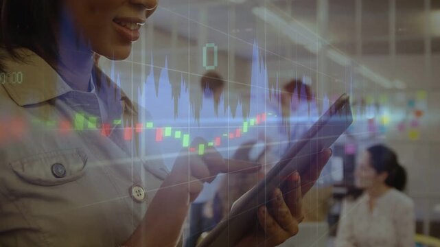 Woman tapping tablet in office, monitoring live finance candles and volume bars overlaying screen