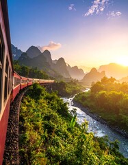 Obraz premium Scenic train journey through lush valleys, a river runs below dramatic mountain ranges, bathed in warm sunlight