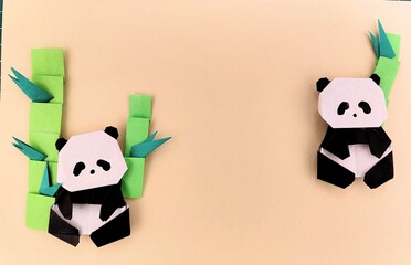 260307193356318 Giant pandas in the bamboo. Made of paper craft. © KK