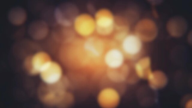 Abstract golden bokeh lights glowing in dark background cinematic motion video effect for elegant holiday celebrations and luxury event backgrounds