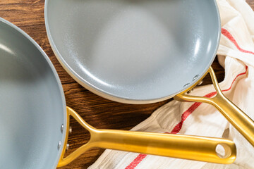 Stacked Frying Pans with Towel Detail