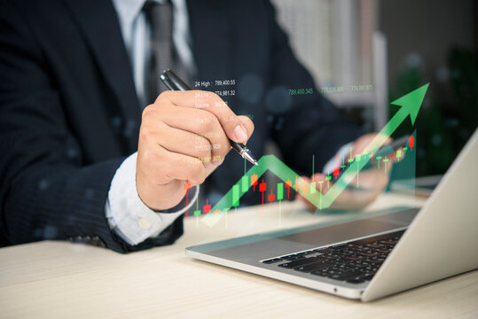 Close up hand operating laptop analyzing stock market financial chart candlestick pattern growth arrow investment strategy wealth management data visualization corporate success.
